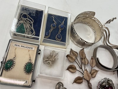 Lot 281 - Group of silver and white metal jewellery including bangles, two Scottish brooches, other brooches, locket pendant on chain, semi-precious gem stone jewellery etc
