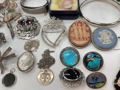 Lot 281 - Group of silver and white metal jewellery including bangles, two Scottish brooches, other brooches, locket pendant on chain, semi-precious gem stone jewellery etc
