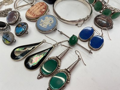 Lot 281 - Group of silver and white metal jewellery including bangles, two Scottish brooches, other brooches, locket pendant on chain, semi-precious gem stone jewellery etc