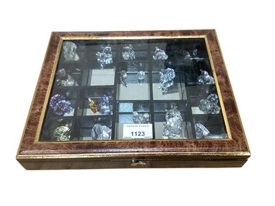 Lot 1123 - Small table top display cabinet housing small Swarovski Crystal items including animals