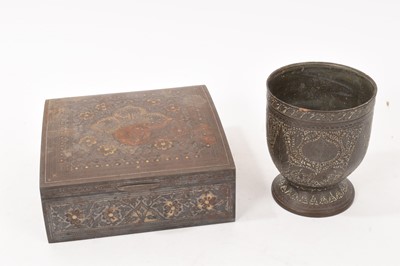 Lot 920 - 19th / early 20th century Indian bidri-ware lidded box, of slightly domed form. 17cm wide, together with an engraved Indian beaker. (2)