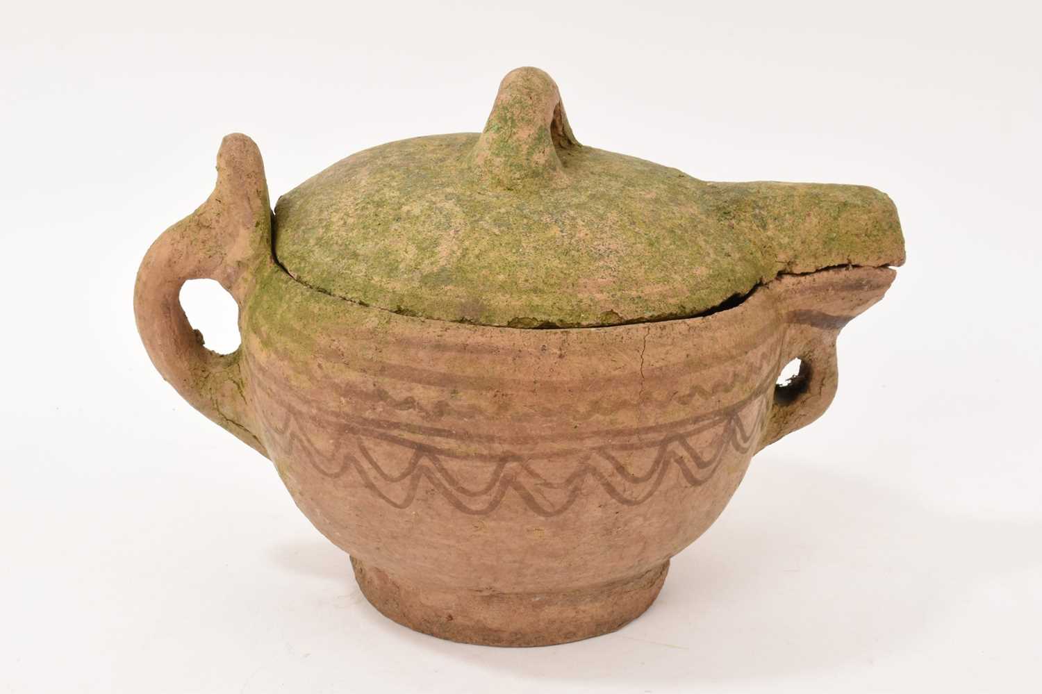 Lot 82 - Antique earthenware jug and cover with patterned decoration, possibly North African