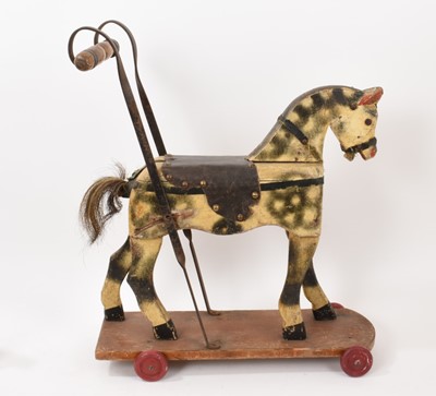Lot 1001 - Early 20th century child’s push along horse