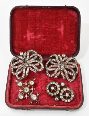 Lot 608 - Four Georgian paste-set brooches to include a pair of ribbon bow brooches converted from buckles