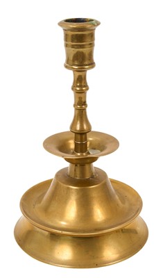 Lot 990 - 17th century style brass capstan candlestick, on spread base