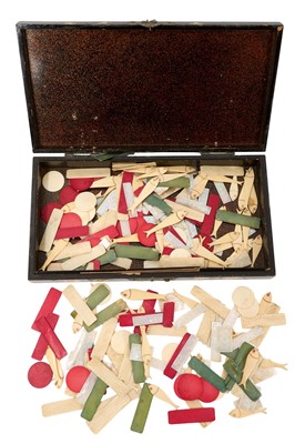 Lot 993 - Collection of 19th century carved and stained bone playing counters, in abalone inlaid papier mache box, 31cm long