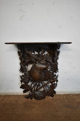 Lot 1516 - Late 19th / early 20th century Black Forest carved lindenwood wall bracket