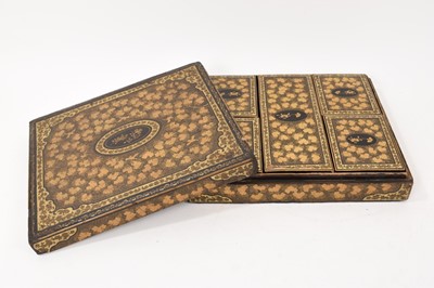 Lot 1038 - 19th century papier mâché counter box, rectangular form, with allover gilt ornament, enclosing an arrangement of six lidded boxes, 30cm wide
