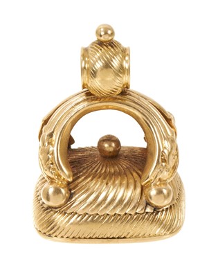 Lot 612 - Regency yellow metal seal, the carnelian seal with finely carved intaglio armorial crest, 30mm.