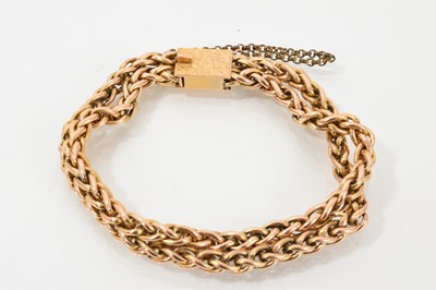 Lot 679 - Late Victorian gold bracelet with a double row of spica link chains and engraved gold box clasp, 19.5cm.