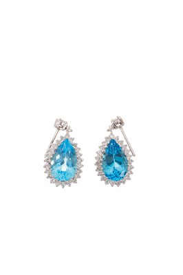 Lot 633 - Pair of diamond and blue topaz pendant earrings