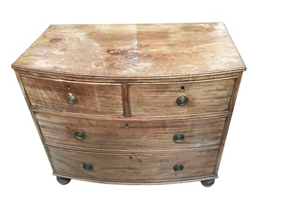 Lot 1201 - Regency mahogany bowfront chest on bun feet