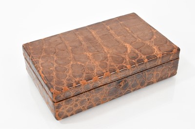 Lot 672 - Edwardian crocodile leather jewellery box with green velvet lined interior
