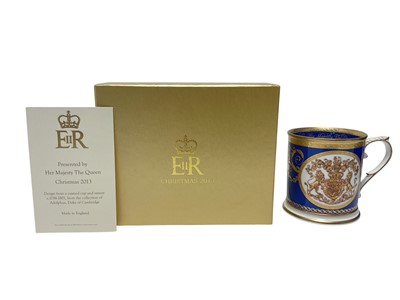 Lot 106 - H.M. Queen Elizabeth II, Royal Household 2013 Christmas gift Royal porcelain mug decorated with Royal Arms in box with card