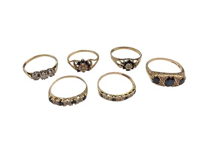 Lot 1170 - Six 9ct gold and gem set dress rings to include a synthetic white three-stone ring and five sapphire rings