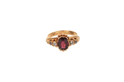 Lot 654 - William IV garnet and diamond ring with an oval mixed cut garnet flanked by four old cut diamonds in gold setting with applied gold beaded decoration, the inside of the shank engraved 'Richard C...