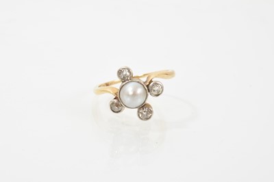 Lot 659 - Edwardian pearl and diamond ring with a central half pearl measuring approximately 6.5mm diameter, with four old cut diamonds in platinum millegrain setting on gold crossover shoulders and taper...