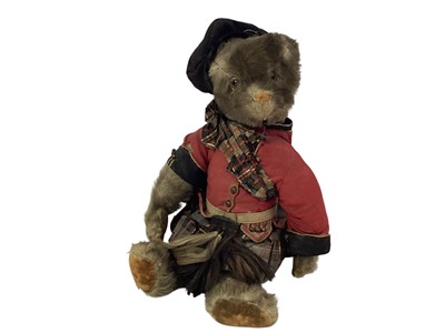 Lot 2052 - Early 20th century teddy bear dressed in Scottish Highland dress with army cap badge to cap and Cameron in blue enamel on sporran.