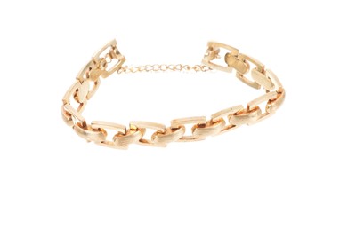 Lot 720 - 1960s/1970s gold bracelet with textured and polished gold links, clasp stamped 585, length 18.5cm.