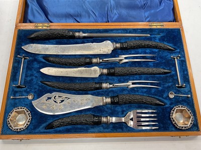 Lot 1174 - Edwardian stag antler carving set with silver collars (Sheffield 1905) in fitted wooden case