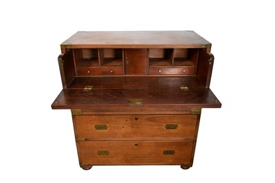Lot 1539 - Good 19th century padouk and brass bound small size campaign chest, in two parts, each with flanking carrying handles, with fitted secretaire drawer and three further drawers, on bun feet, 82cm...