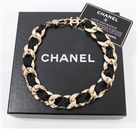 Lot 3197 - Chanel black silk ribbon gilt metal chain...