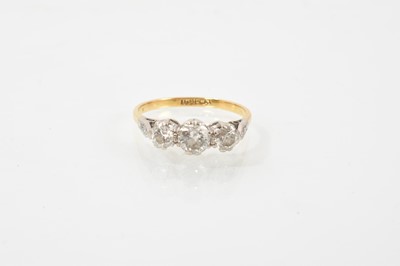 Lot 742 - Diamond three stone ring in platinum claw setting on 18ct yellow gold shank