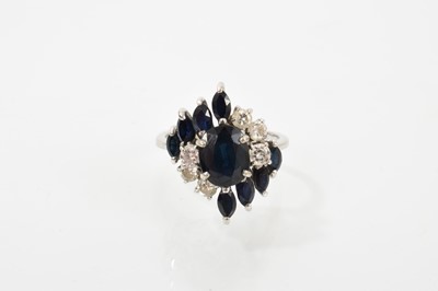 Lot 745 - Sapphire and diamond cluster ring in 18ct white gold setting