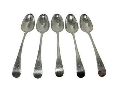 Lot 592 - Pair of George III silver Old English pattern tablespoons, with bright cut engraved decoration, (London 1796), together with three other similar tablespoons, (London 1783), all at approx. 11ozs (5).