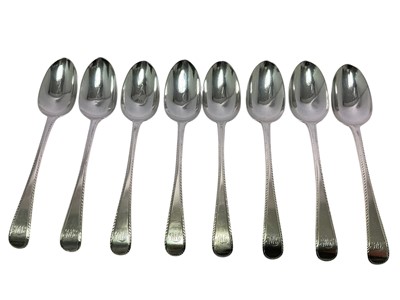 Lot 593 - Set of eight Victorian silver Old English pattern tablespoons, with feather edge decoration, and engraved initials (London 1847), maker George Adams, all at approx. 17ozs (8).