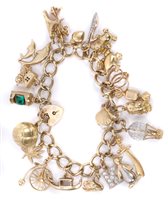 Lot 3201 - Gold (9ct) charm bracelet with quantity of...