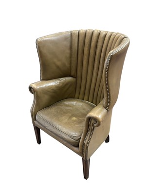 Lot 1594 - George III style leather upholstered barrel back armchair, raised on reeded tapered legs