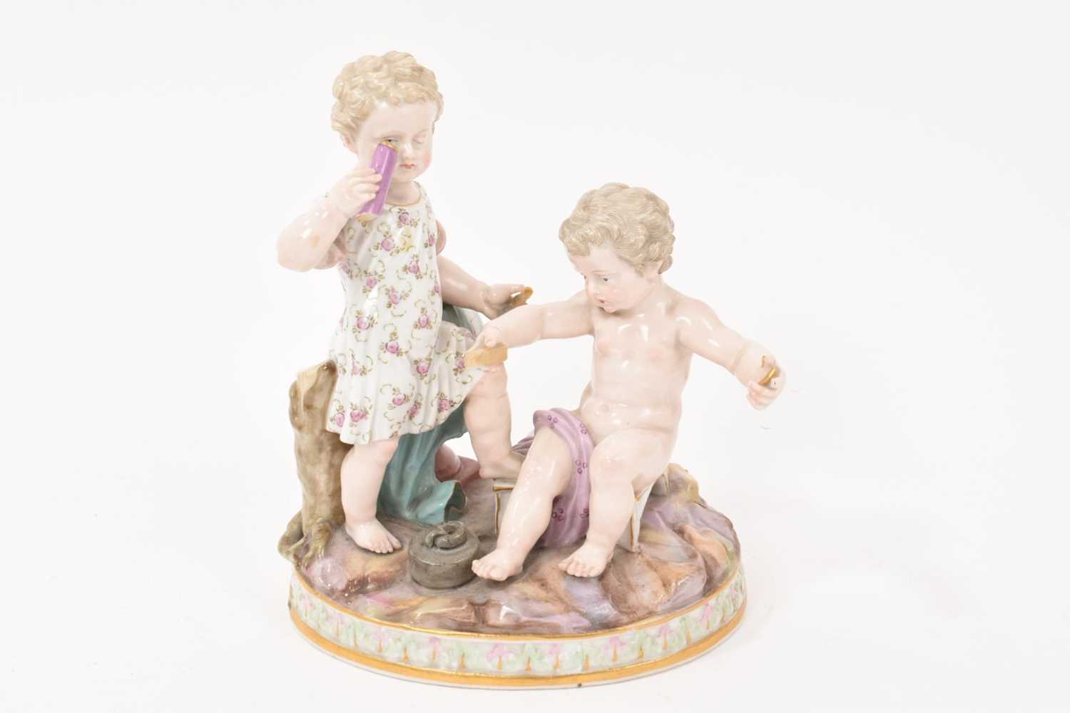 Lot 77 - 19th century Meissen figure group, an allegory of geometry, in the form of two cherubs with instruments, crossed swords and incised marks to base, 15.5cm high