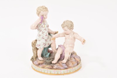 Lot 348 - A 19th century Meissen figure group, an allegory of geometry, in the form of two cherubs with instruments, crossed swords and incised marks to base, 15.5cm high
