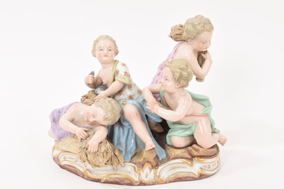 Lot 349 - A 19th century Meissen figure group, an allegory of Summer, modelled with four figures carrying and resting on sheafs of wheat, crossed swords and incised model number '2490' to base, 16cm high<...
