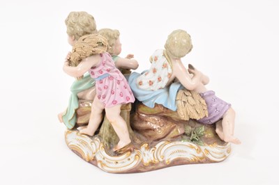 Lot 76 - 19th century Meissen figure group, an allegory of Summer, modelled with four figures carrying and resting on sheafs of wheat, crossed swords and incised model number '2490' to base, 16cm high<...
