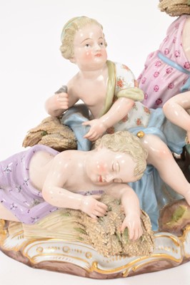 Lot 76 - 19th century Meissen figure group, an allegory of Summer, modelled with four figures carrying and resting on sheafs of wheat, crossed swords and incised model number '2490' to base, 16cm high<...