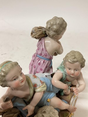 Lot 76 - 19th century Meissen figure group, an allegory of Summer, modelled with four figures carrying and resting on sheafs of wheat, crossed swords and incised model number '2490' to base, 16cm high<...
