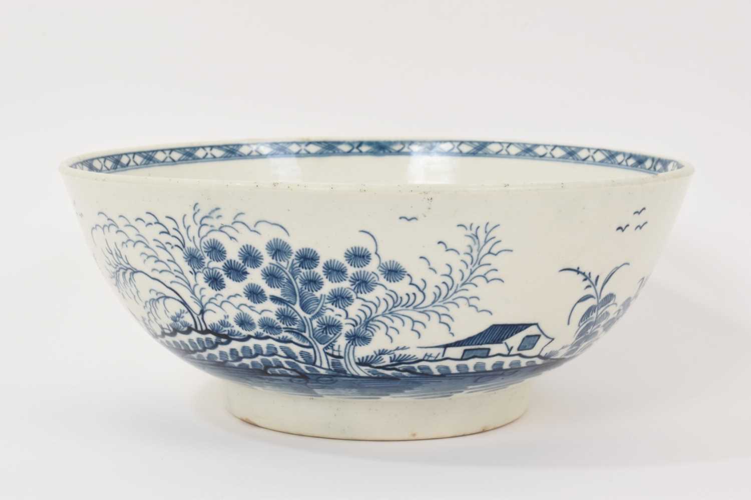 Lot 67 - Worcester blue and white bowl, circa 1775, painted in the Rock Strata Island pattern, 22.75cm diameter