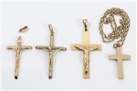 Lot 3210 - Three gold (9ct) crucifix pendants and a gold...