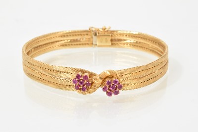 Lot 375 - 18ct stamped and ruby bracelet