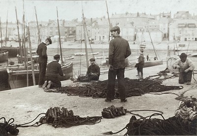 Lot 50 - Net Menders St Ives, photograph circa 1900-1920, signed indistinctly, 24cm x 34cm, in glazed frame
