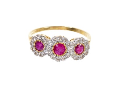 Lot 383 - Edwardian style ruby and diamond triple cluster ring in 18ct gold setting