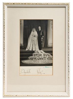 Lot 24 - The Wedding of H.R.H. The Princess Elizabeth to Lieutenant Philip Mountbatten R.N., signed 1947 wedding photograph by Baron in glazed frame