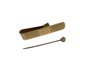 Lot 97 - Victorian gold and old cut diamond stick pin and a 9ct gold money clip (2)