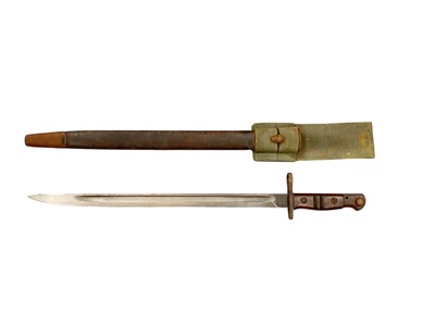 Lot 941 - First World War American 1917 pattern Remington bayonet (sharpened for active service), in scabbard with a canvas webbing frog.
