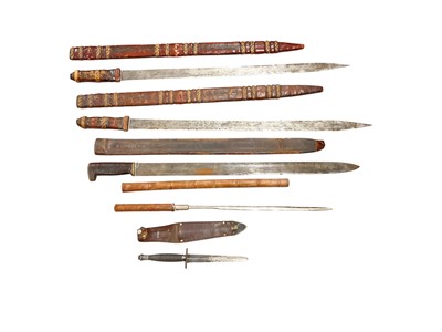 Lot 944 - Two African swords, together with a third pattern Fairbairn Sykes F-S fighting knife, a dagger stick and and other knife (5).