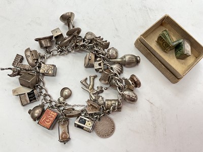 Lot 1076 - Vintage silver charm bracelet with a good collection of silver charms