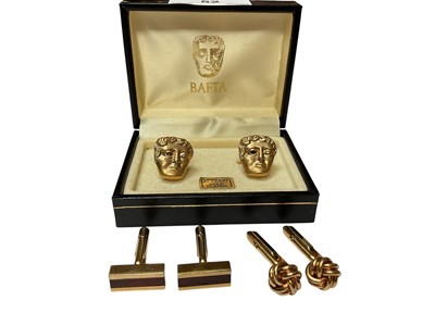 Lot 52 - Pair of BAFTA 22ct gold plated cufflinks in presentation box, pair of Yves Saint Laurent cufflinks and one other pair of cufflinks