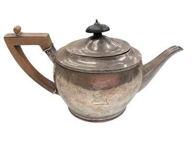 Lot 1047 - Edwardian silver teapot with engraved crest and turned wood handle (London 1909)